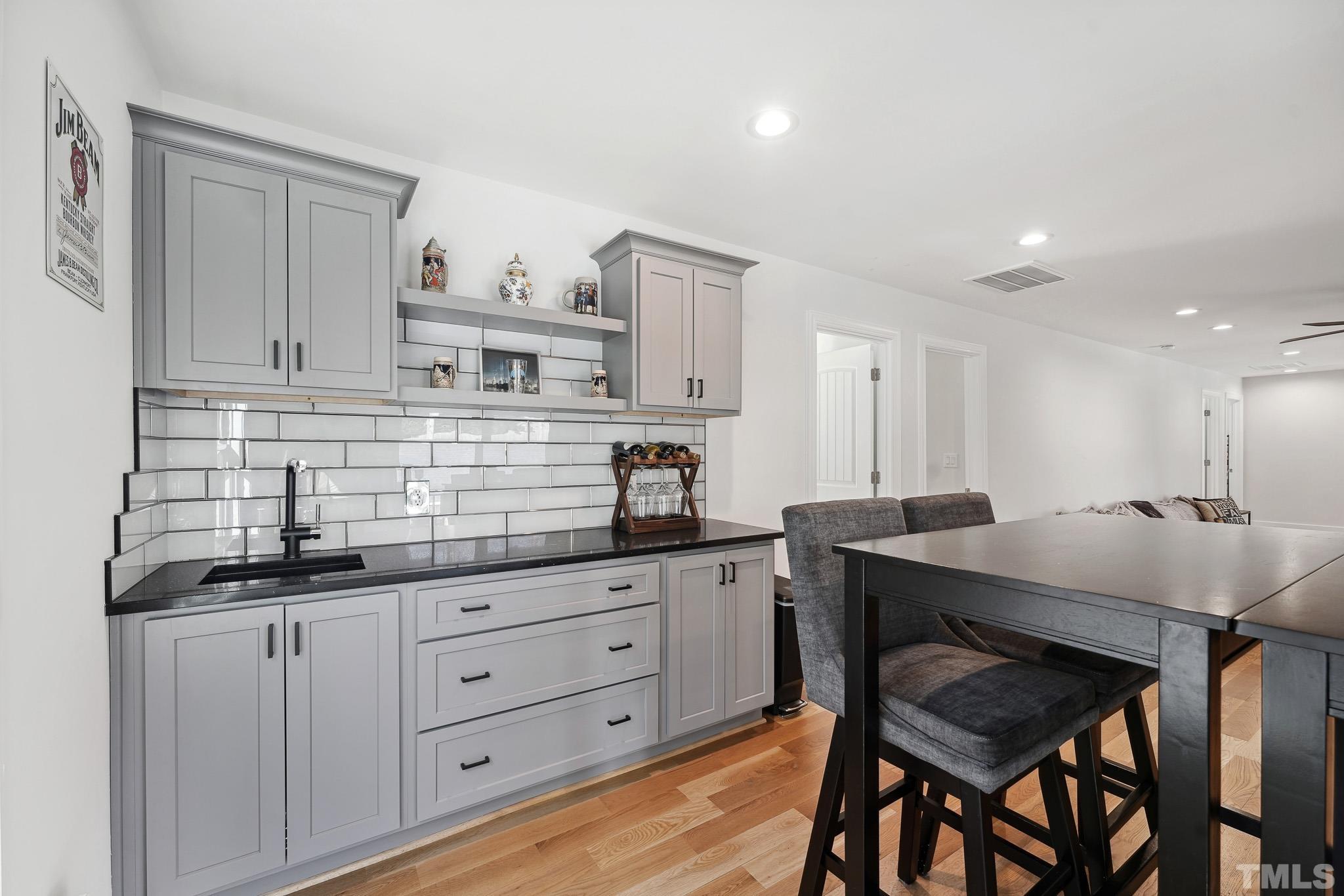 2632 Purnell Road Wake Forest, NC 27587 - Photo 2 of 60 a kitchen with granite countertop white cabinets and chairs