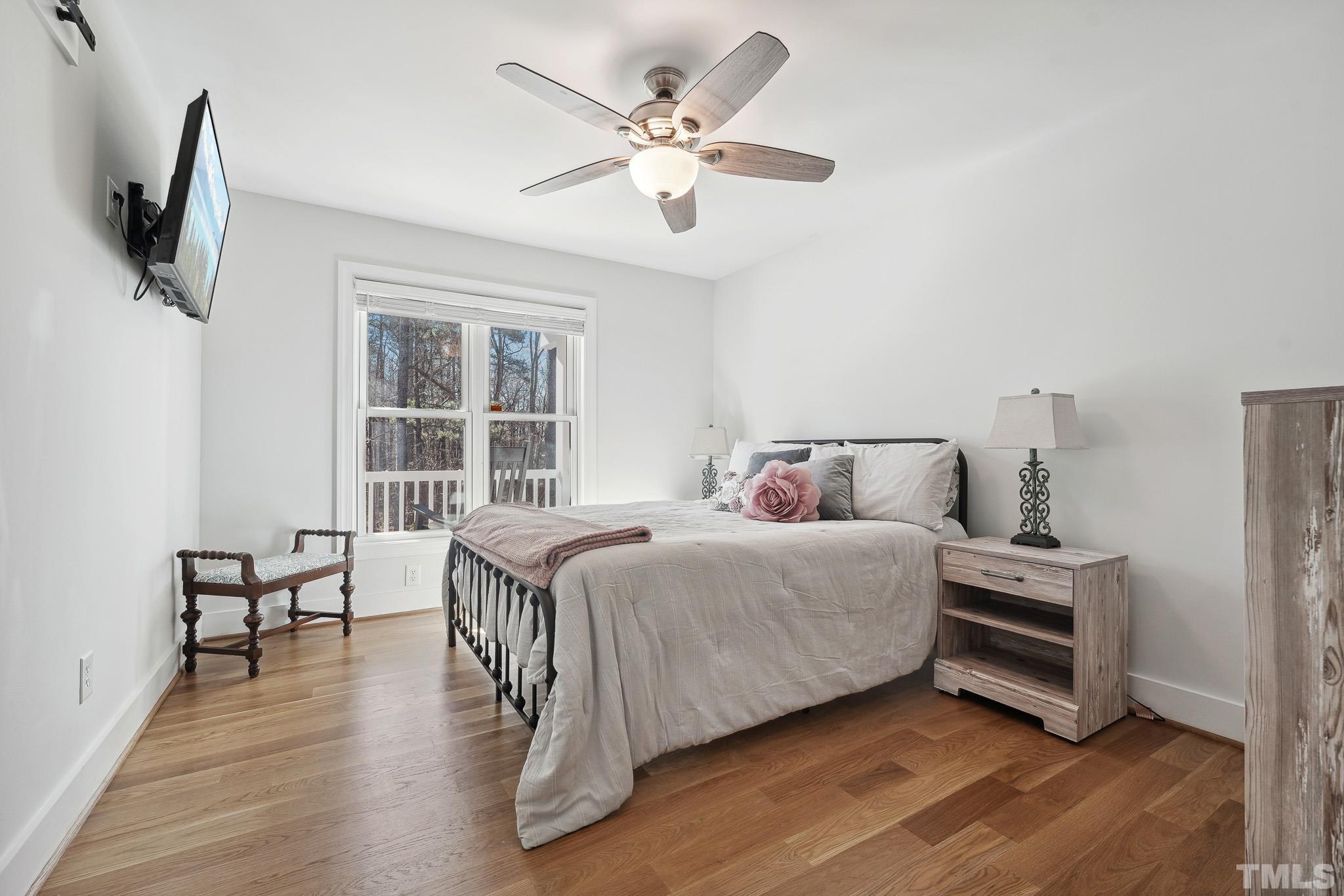 2632 Purnell Road Wake Forest, NC 27587 - Photo 21 of 60 a bedroom with a bed and a large window