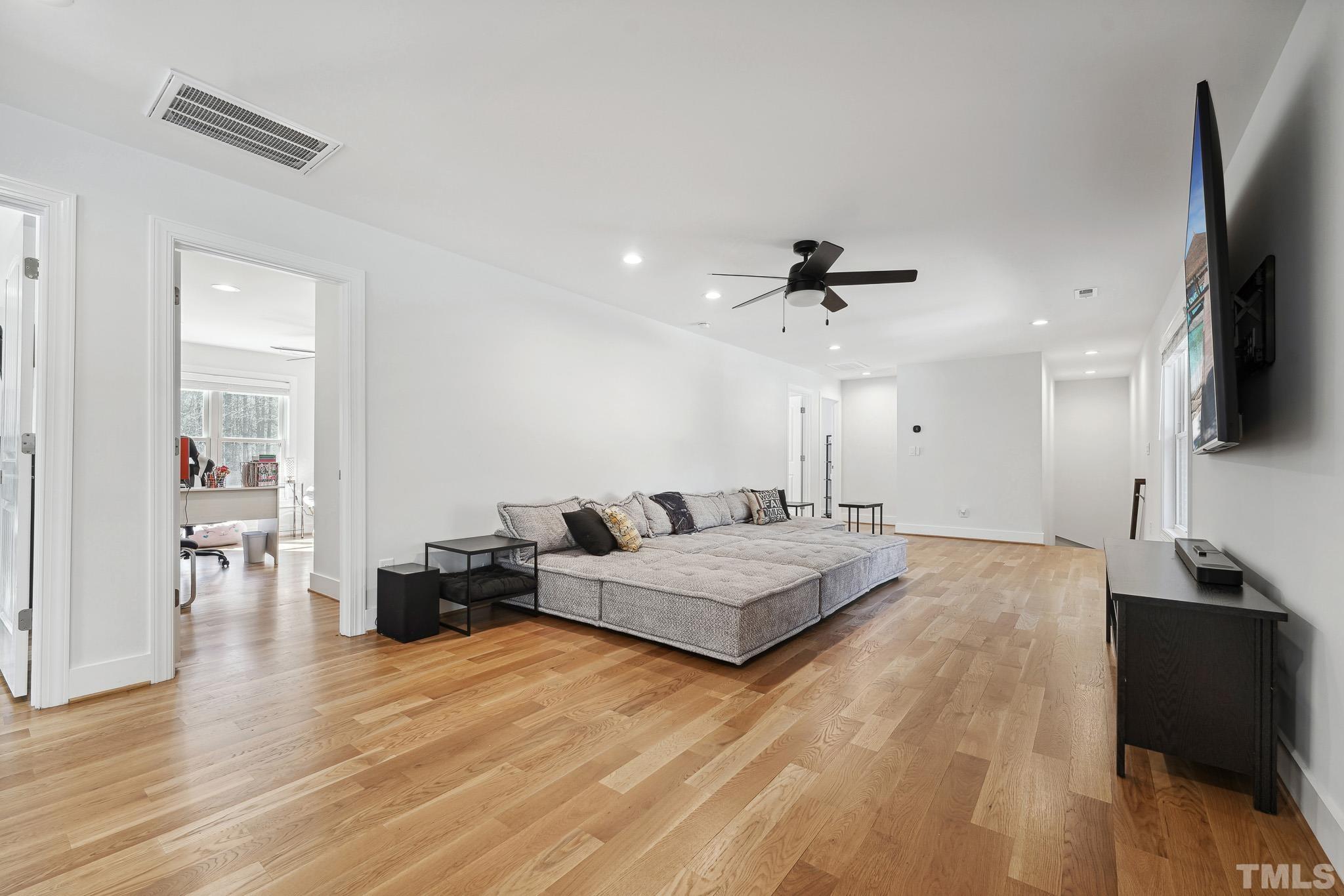 2632 Purnell Road Wake Forest, NC 27587 - Photo 31 of 60 a living room with furniture and a flat screen tv
