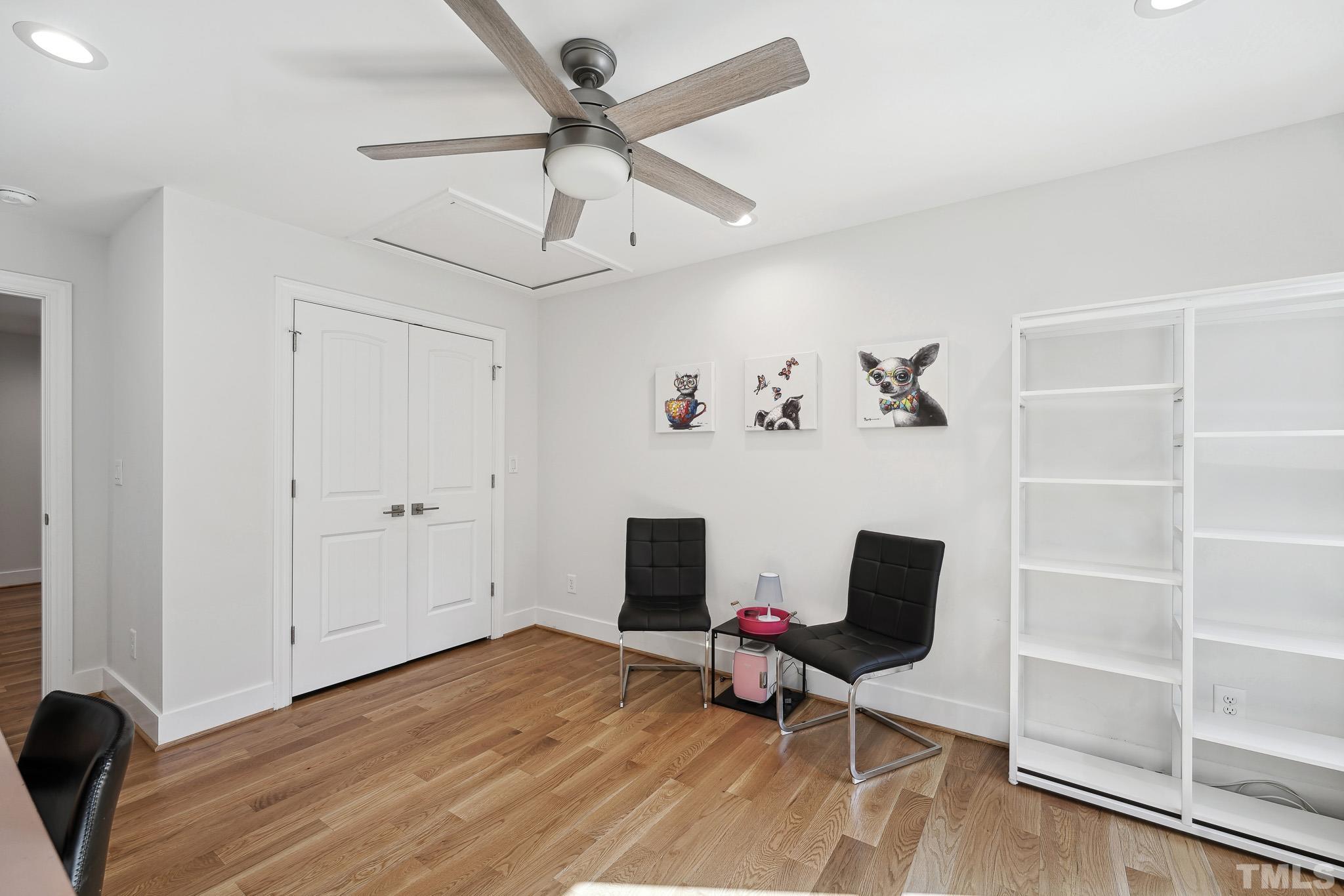 2632 Purnell Road Wake Forest, NC 27587 - Photo 37 of 60 a workspace with wooden floor a ceiling fan and a window