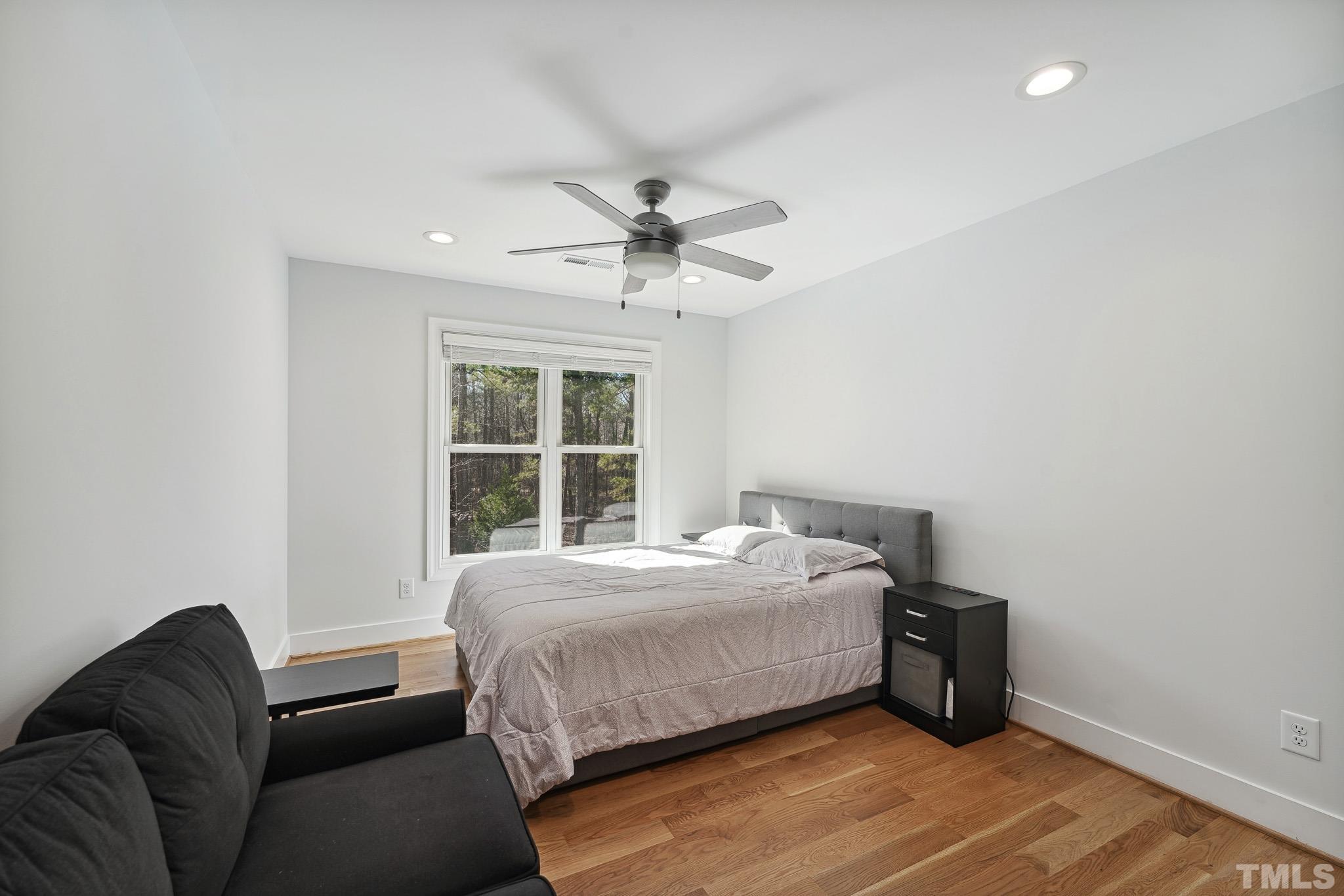 2632 Purnell Road Wake Forest, NC 27587 - Photo 38 of 60 a bedroom with a bed and a couch