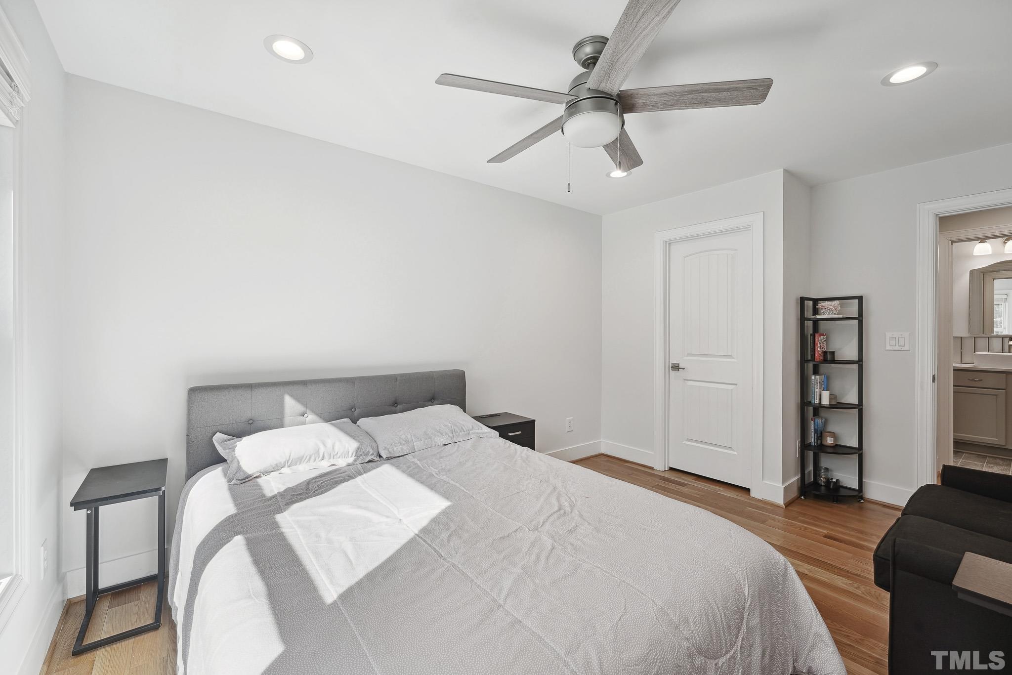 2632 Purnell Road Wake Forest, NC 27587 - Photo 39 of 60 a bedroom with a bed and a chair