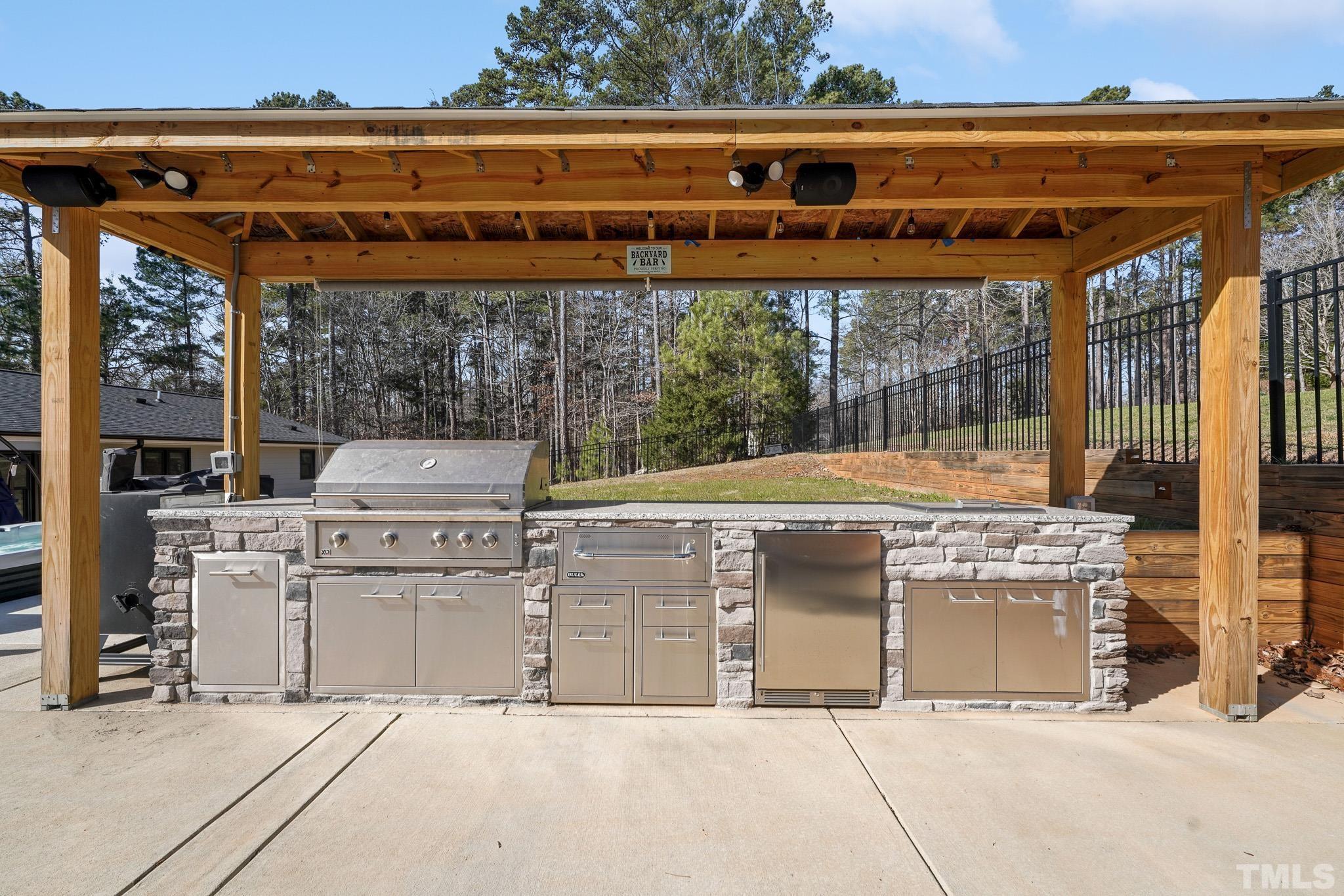 2632 Purnell Road Wake Forest, NC 27587 - Photo 48 of 60 a view of a back yard with a wooden fence