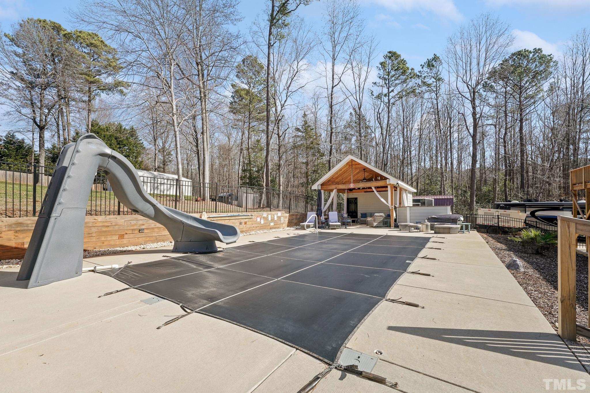 2632 Purnell Road Wake Forest, NC 27587 - Photo 49 of 60 a view of wooden staircase with a table and chairs