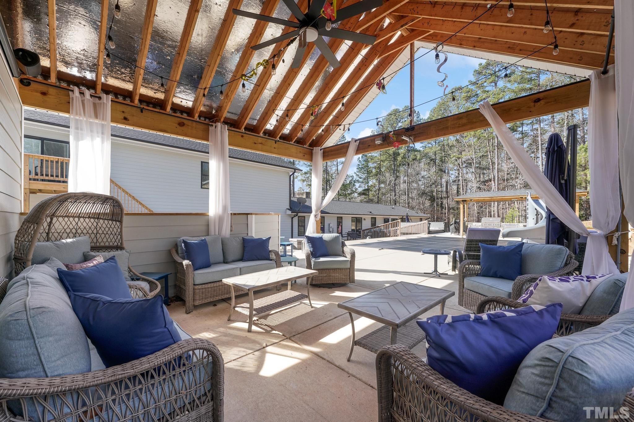 2632 Purnell Road Wake Forest, NC 27587 - Photo 52 of 60 a living room with furniture and a large window