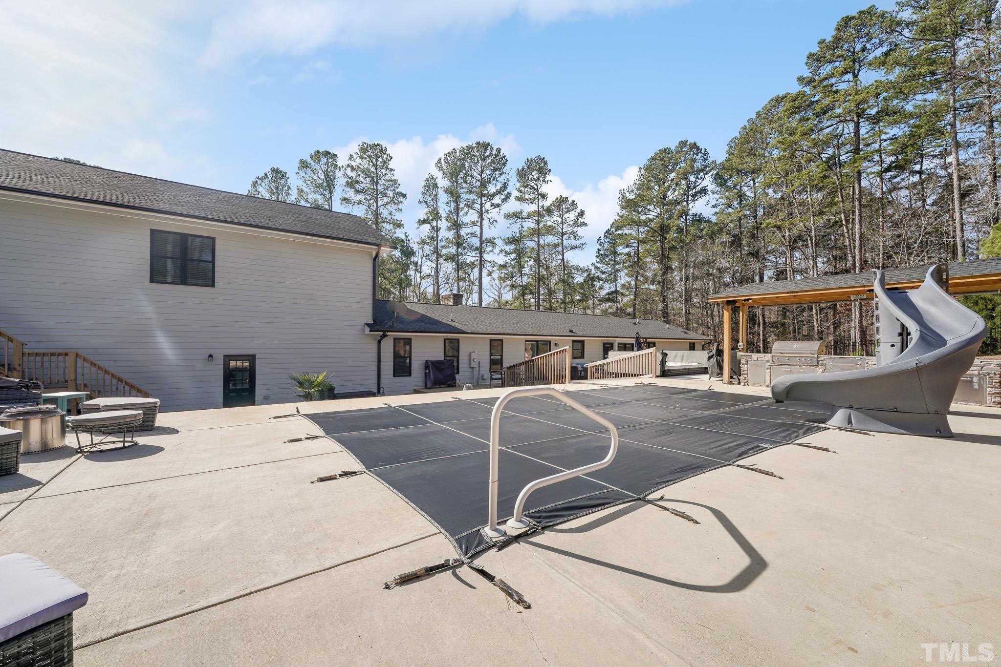 2632 Purnell Road Wake Forest, NC 27587 - Photo 53 of 60 a view of a house with pool and chairs