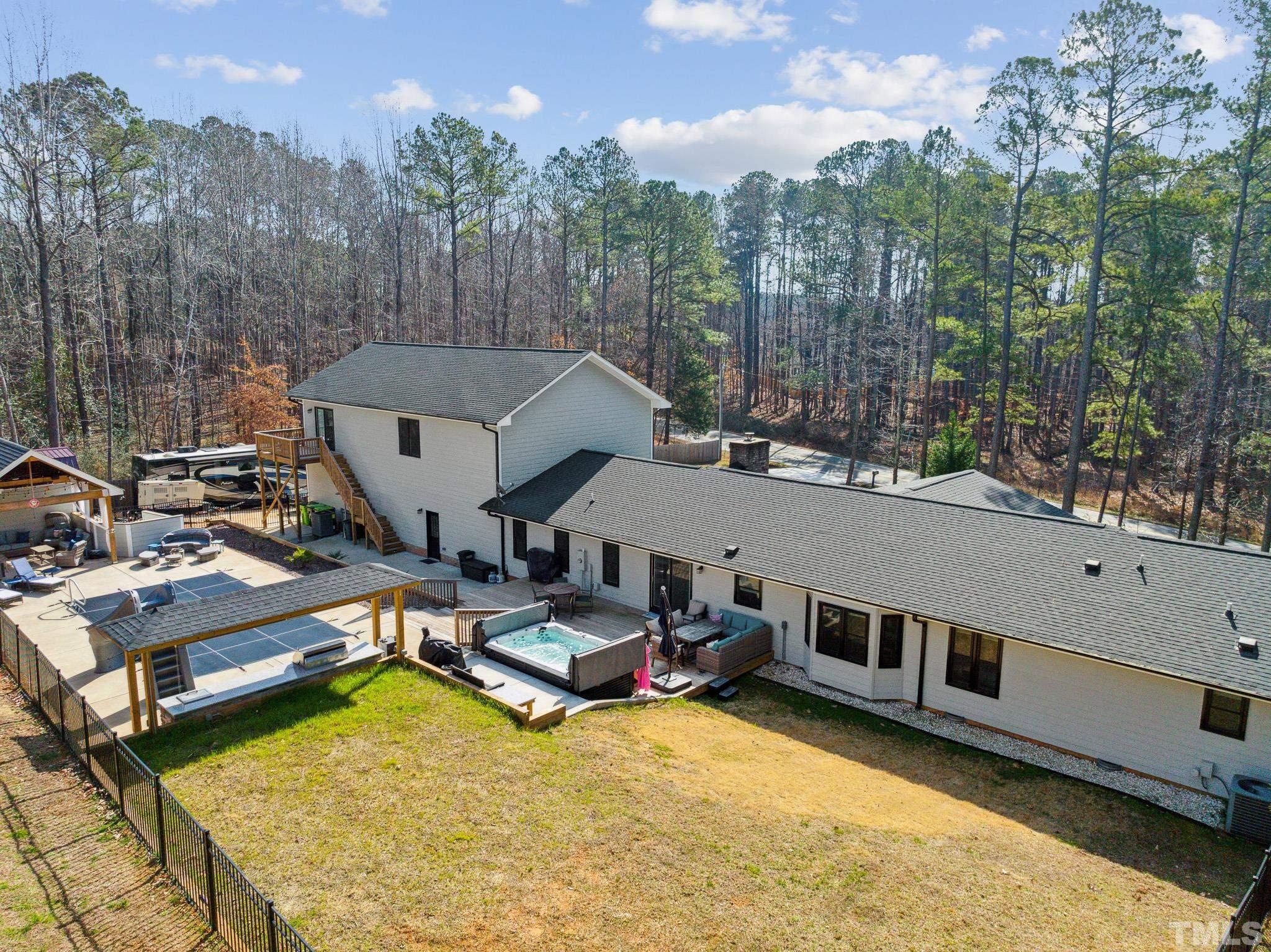 2632 Purnell Road Wake Forest, NC 27587 - Photo 59 of 60 a aerial view of a house with swimming pool and sitting area