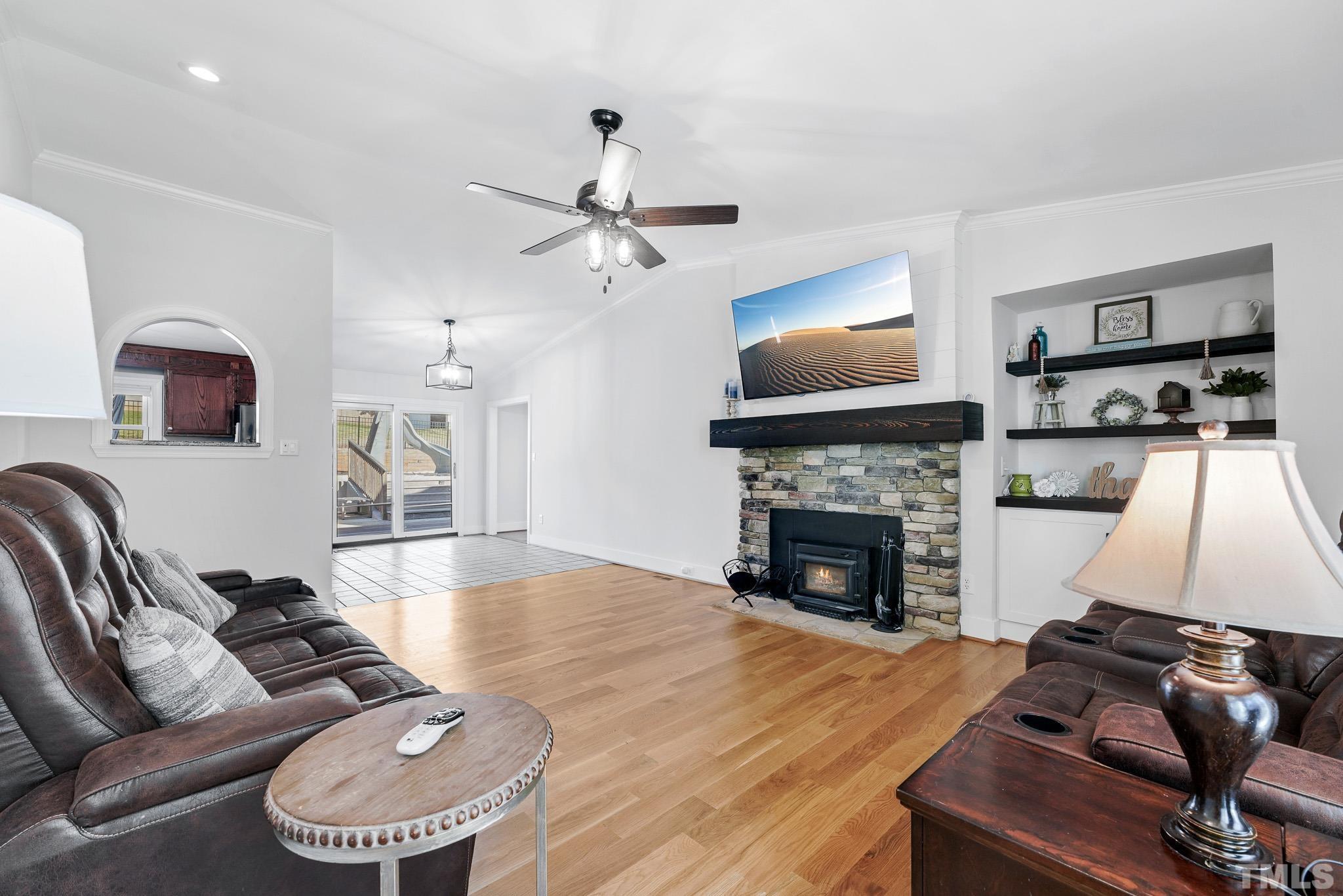 2632 Purnell Road Wake Forest, NC 27587 - Photo 9 of 60 a living room with furniture fireplace and flat screen tv