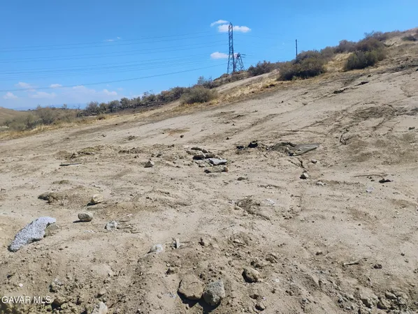 a view of a beach with a mountain view in back