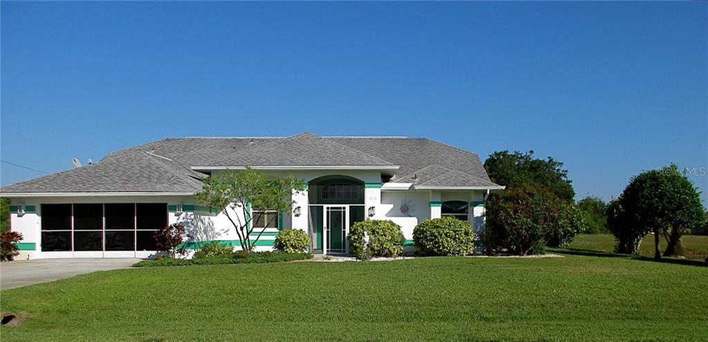 213 Sportsman Road Rotonda West, FL 33947 - Photo 1 of 1 Great curb appeal, canal on right side