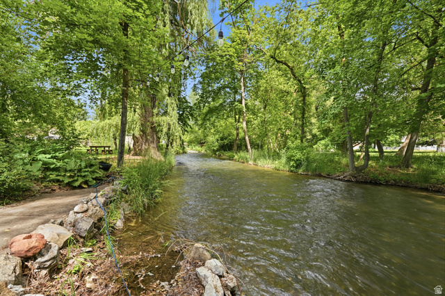 778 East 200 North Logan, UT 84321 - Photo 2 of 43 Property featuring a natural waterway bordered by extensive foliage