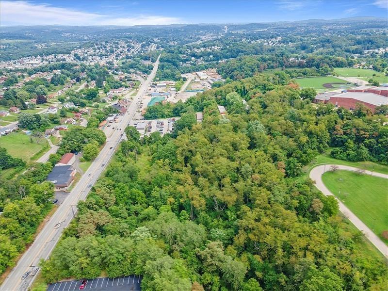 0 East Route 30 Irwin, PA 15642 - Photo 12 of 14 an aerial view of green landscape with trees houses and mountain view
