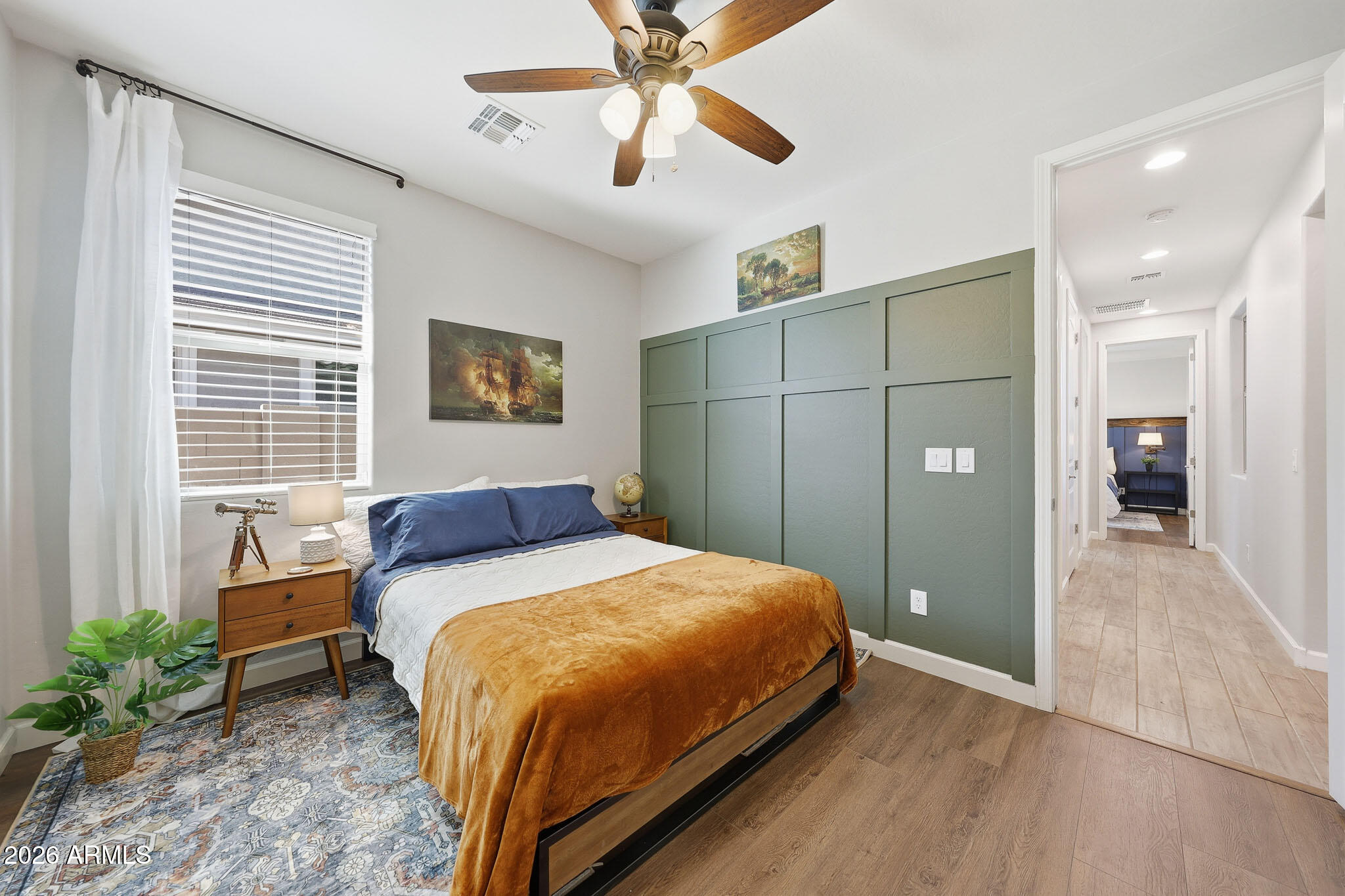 22133 East Russet Road Queen Creek, AZ 85142 - Photo 14 of 61 a bedroom with a bed and a chandelier