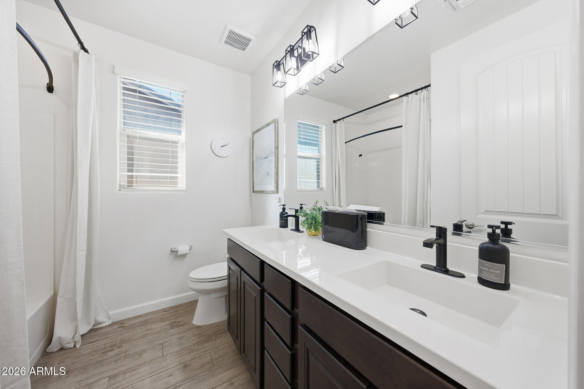 22133 East Russet Road Queen Creek, AZ 85142 - Photo 15 of 61 a bathroom with a sink a toilet and shower