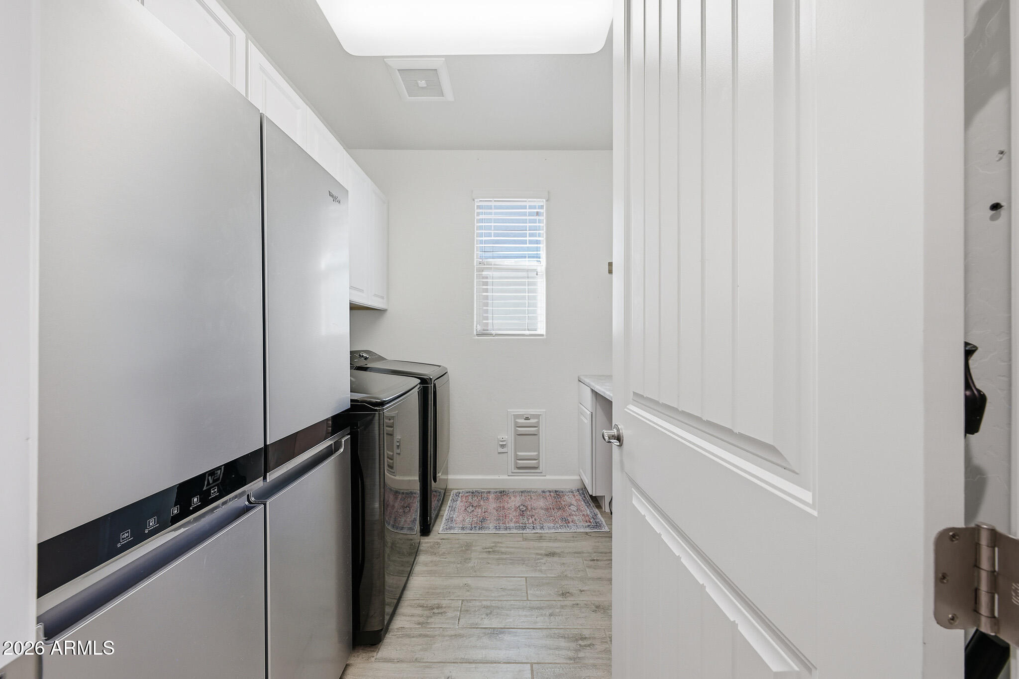 22133 East Russet Road Queen Creek, AZ 85142 - Photo 16 of 61 a hallway with cabinets