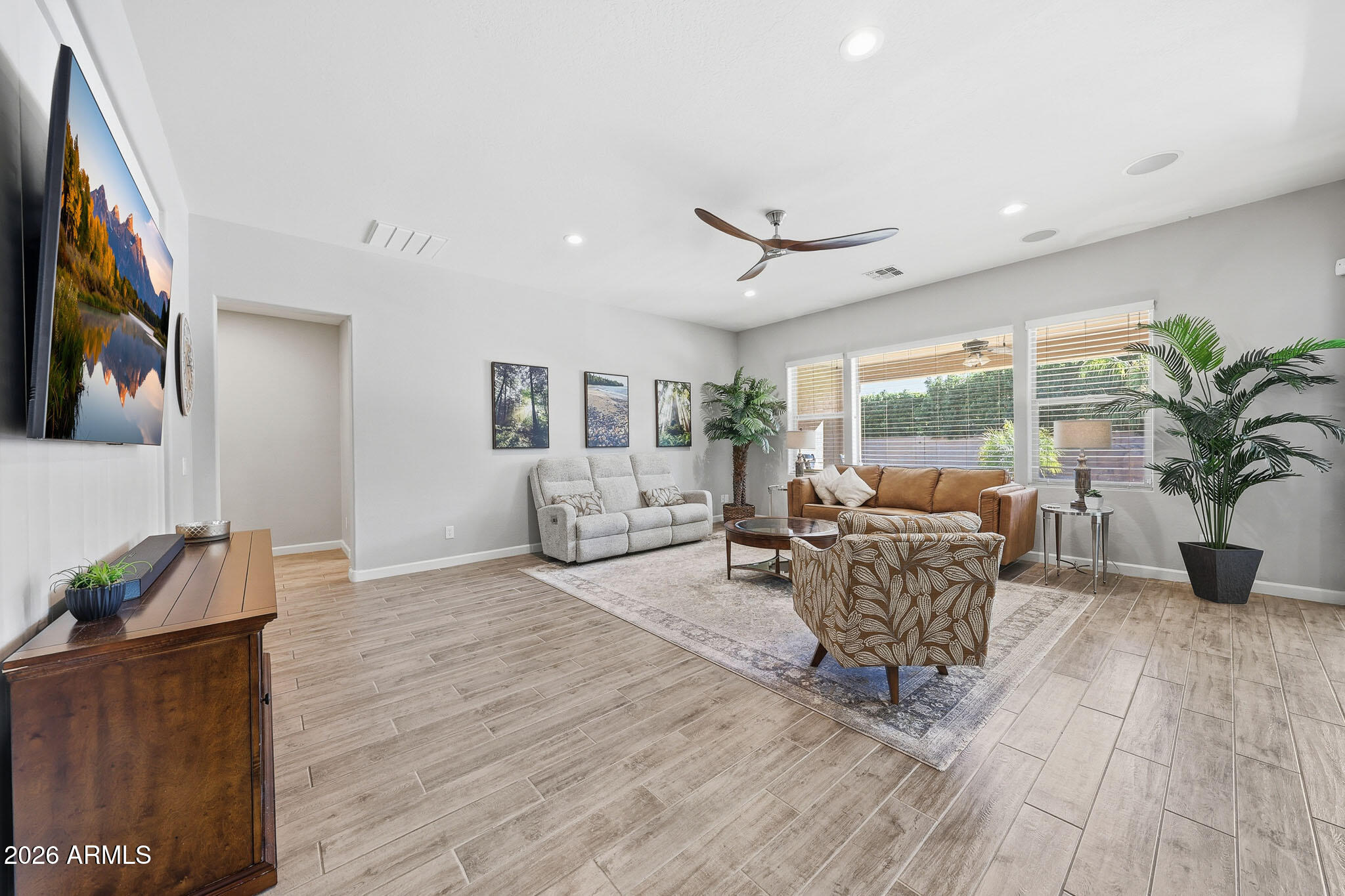 22133 East Russet Road Queen Creek, AZ 85142 - Photo 18 of 61 a living room with furniture and a large window
