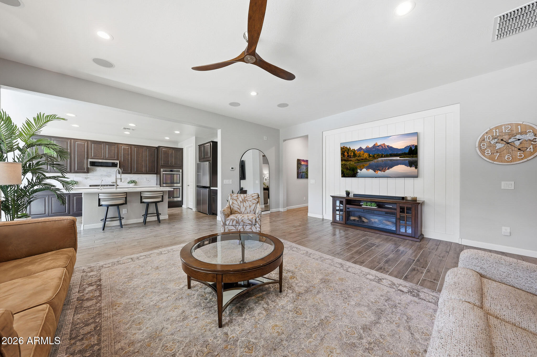 22133 East Russet Road Queen Creek, AZ 85142 - Photo 20 of 61 a living room with furniture and a flat screen tv