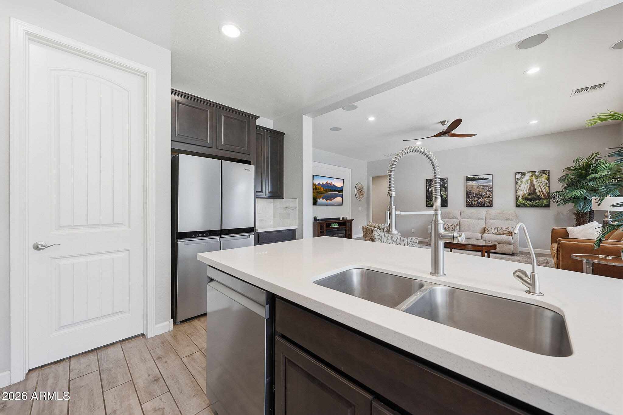 22133 East Russet Road Queen Creek, AZ 85142 - Photo 24 of 61 a kitchen with kitchen island a sink stove and refrigerator