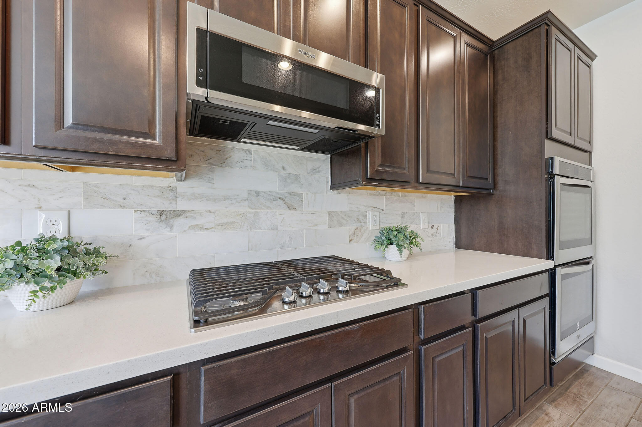 22133 East Russet Road Queen Creek, AZ 85142 - Photo 25 of 61 a kitchen with stainless steel appliances granite countertop a refrigerator and a stove