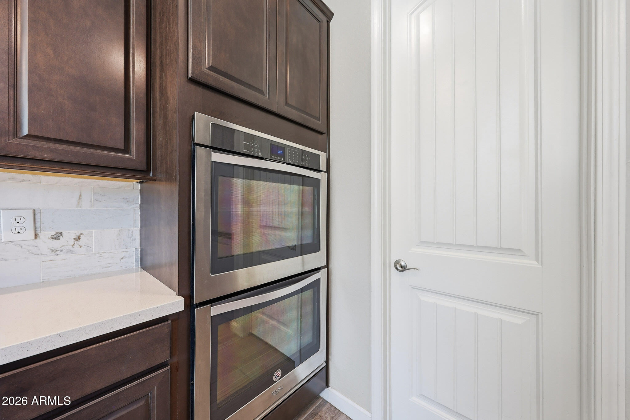 22133 East Russet Road Queen Creek, AZ 85142 - Photo 26 of 61 a close view of a microwave and cabinets