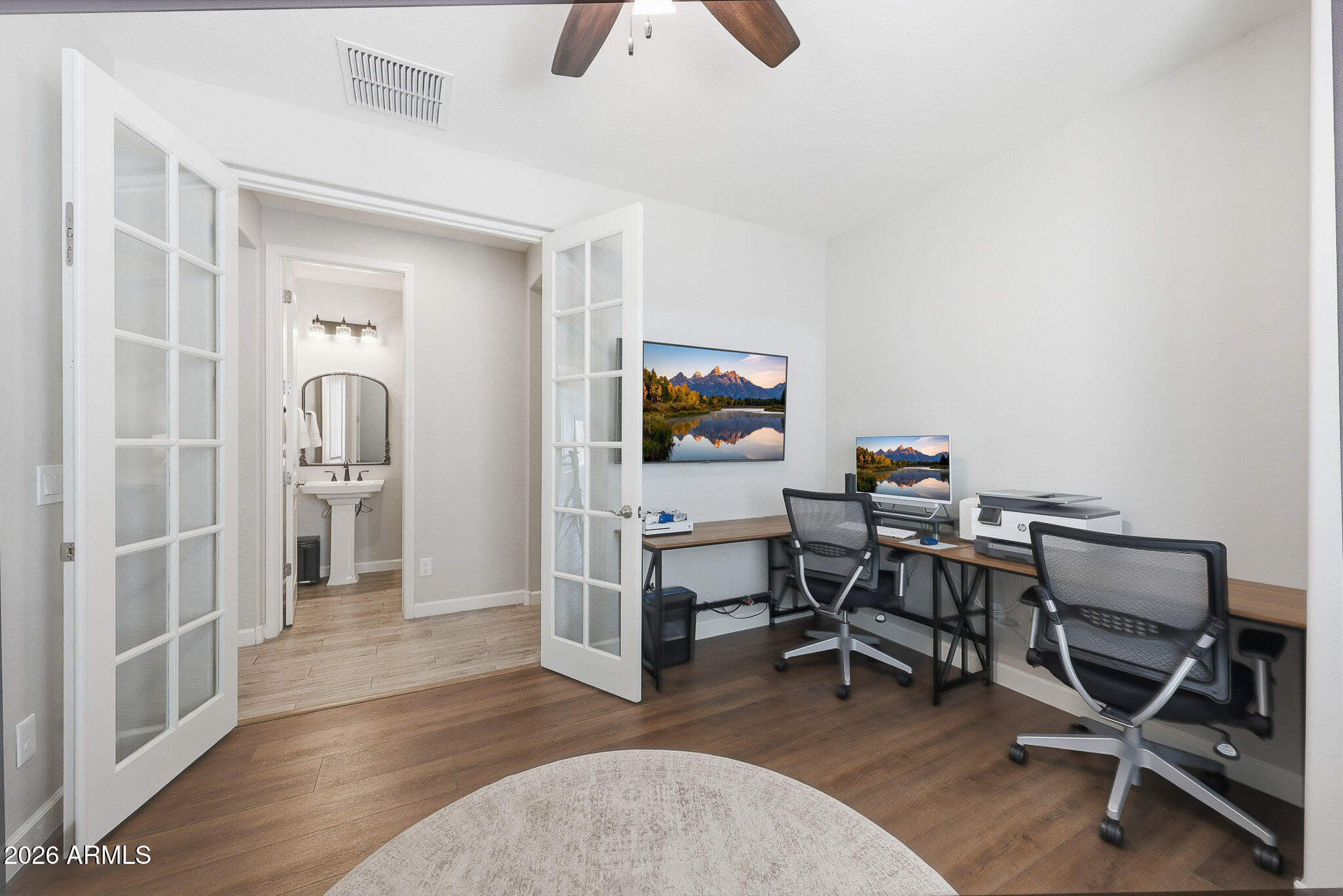 22133 East Russet Road Queen Creek, AZ 85142 - Photo 31 of 61 a view of a workspace with furniture and wooden floor