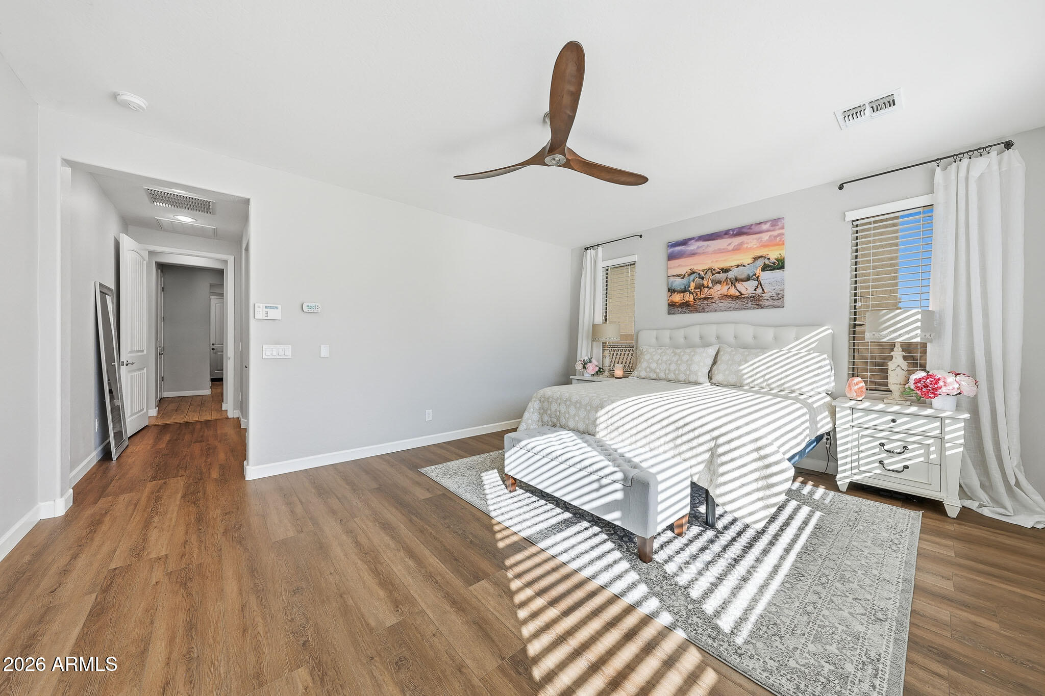 22133 East Russet Road Queen Creek, AZ 85142 - Photo 39 of 61 a bedroom with a bed and a painting on the wall