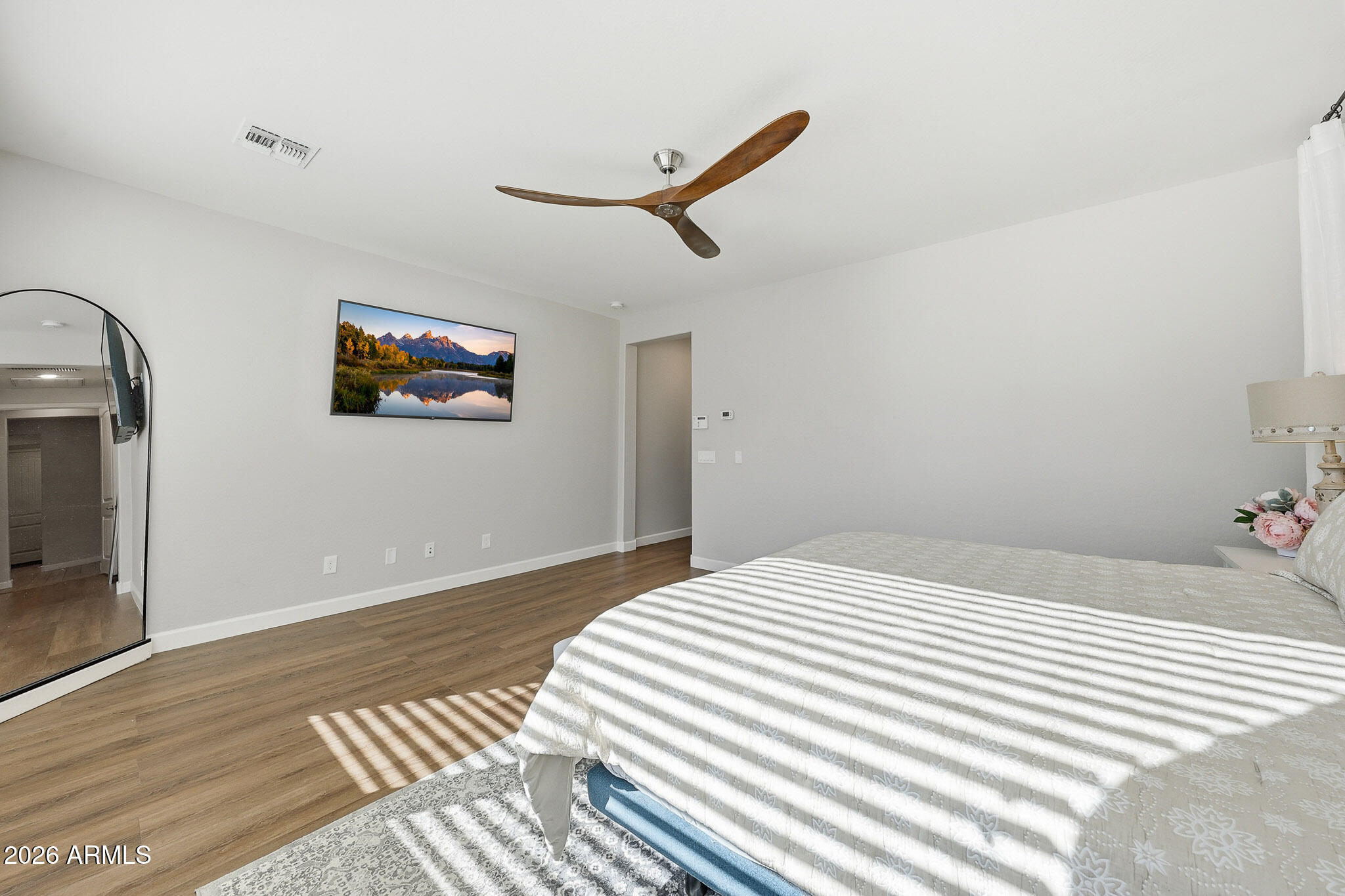 22133 East Russet Road Queen Creek, AZ 85142 - Photo 40 of 61 a bedroom with a bed and a wall painting