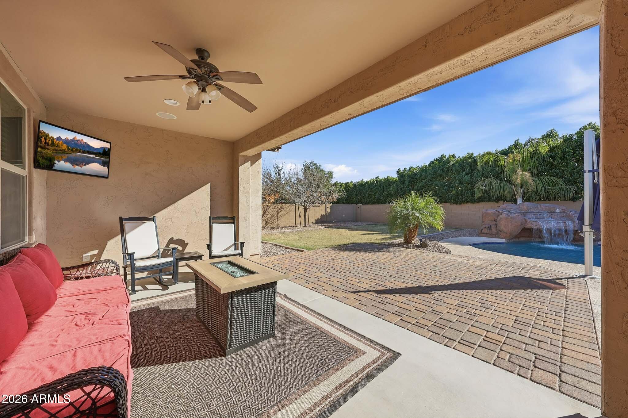 22133 East Russet Road Queen Creek, AZ 85142 - Photo 44 of 61 a living room with furniture and a floor to ceiling window