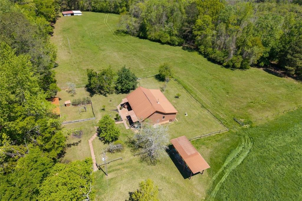 an aerial view of residential house with swimming pool
