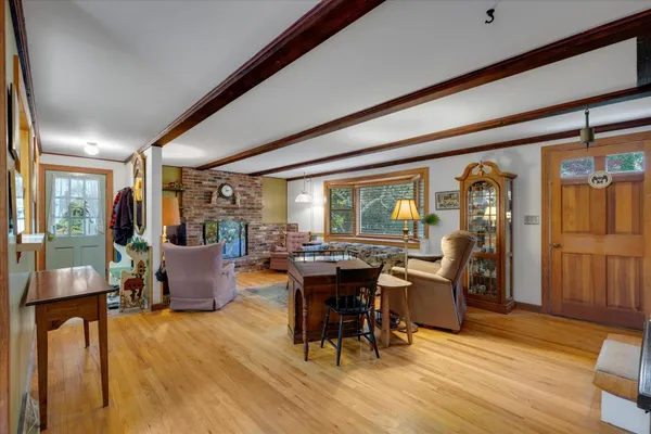 a view of a dining room with furniture window and wooden floor