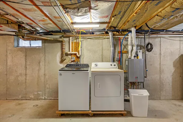 a utility room with dryer and washer