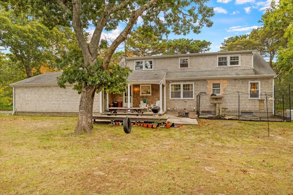 a view of a house with swimming pool and sitting area