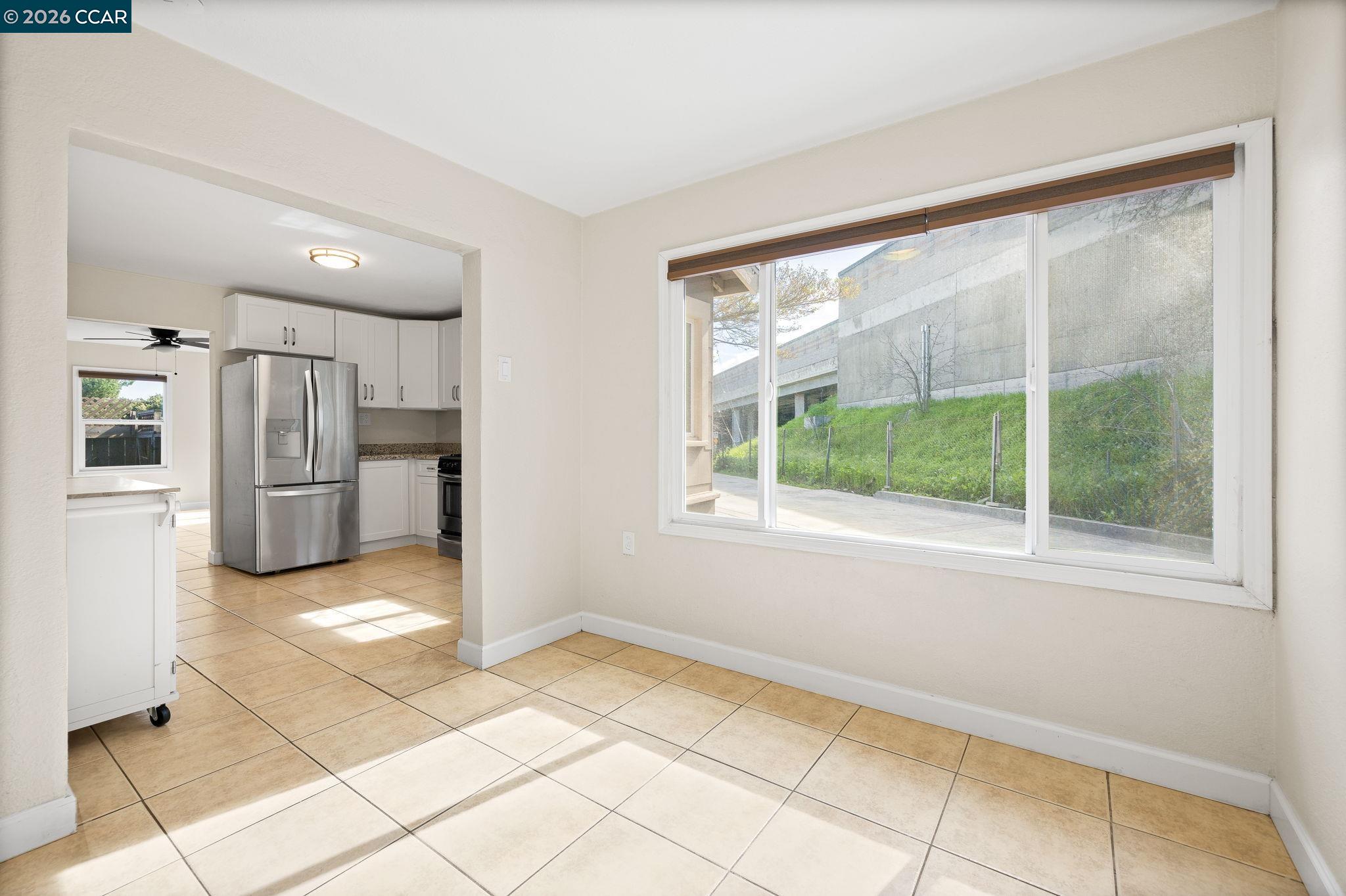 4820 Blum Road Martinez, CA 94553 - Photo 12 of 46 a view of a refrigerator in kitchen and a window