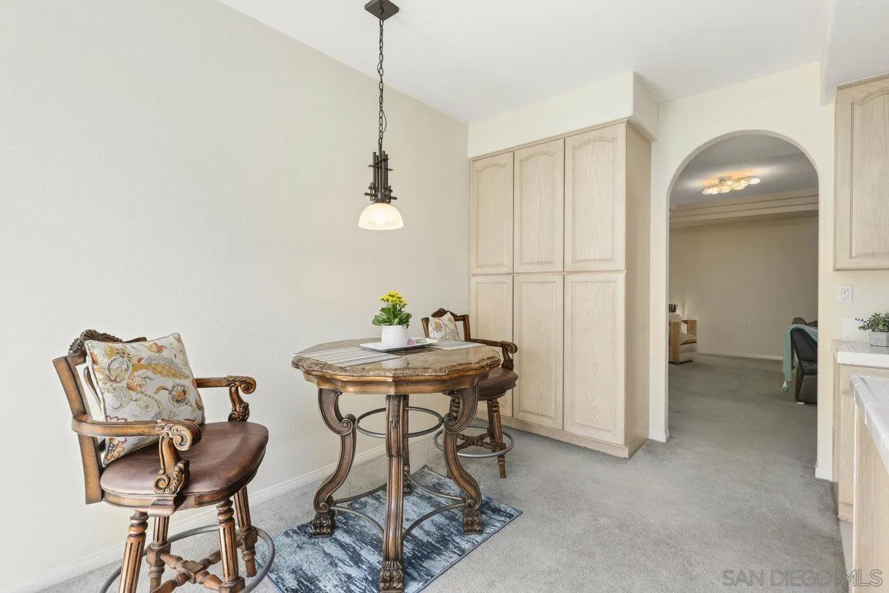 3365 Genoa Way, Unit 140 Oceanside, CA 92056 - Photo 15 of 32 a view of a room with furniture and wooden floor