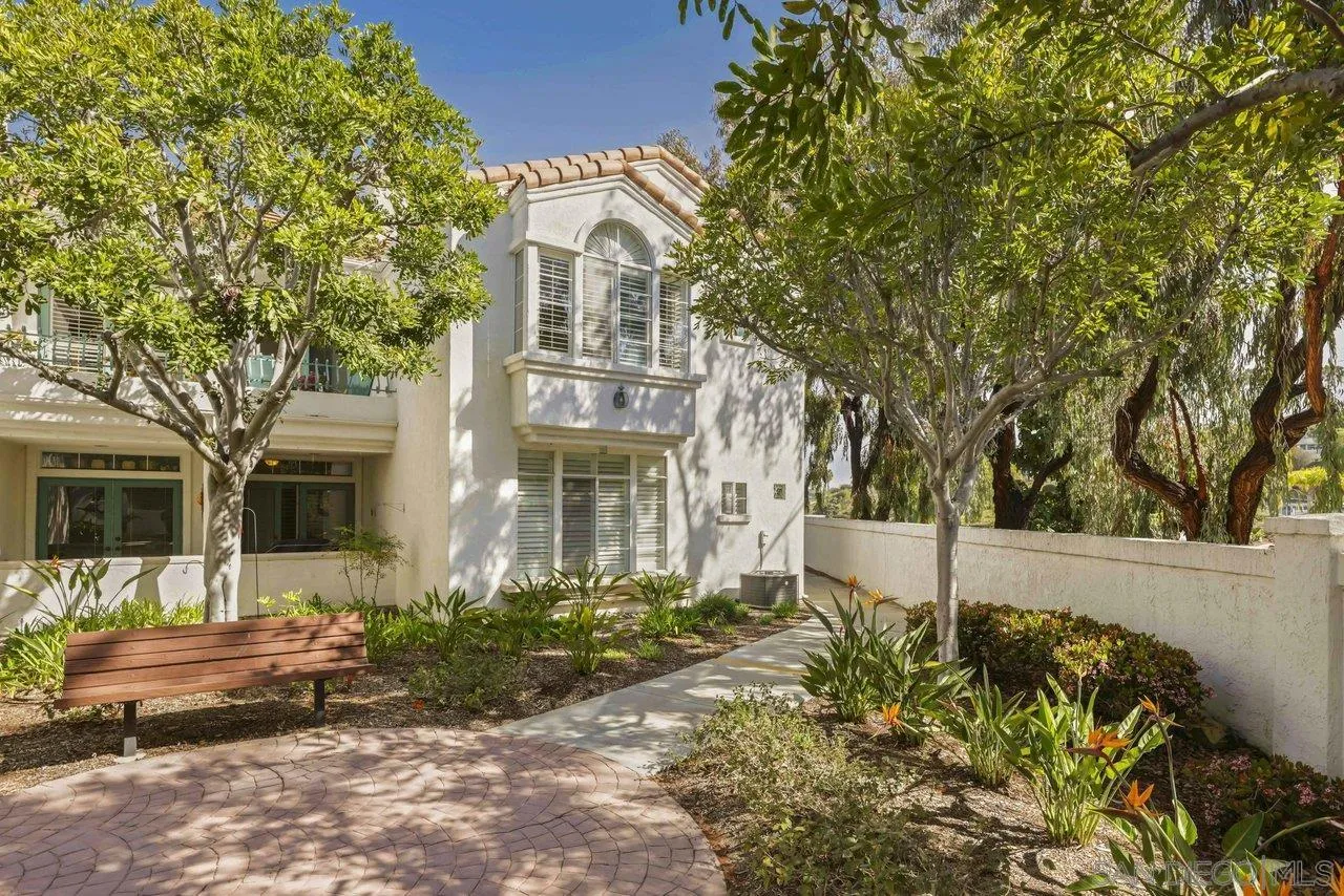 3365 Genoa Way, Unit 140 Oceanside, CA 92056 - Photo 2 of 32 a front view of a house with a yard