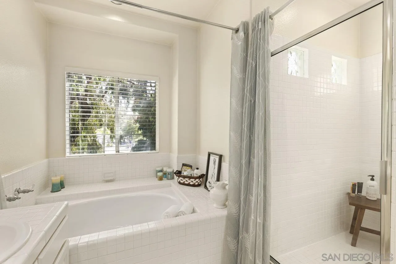 3365 Genoa Way, Unit 140 Oceanside, CA 92056 - Photo 26 of 32 a white bath tub with a shower