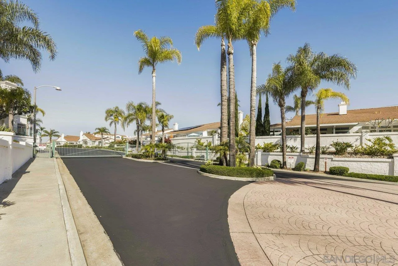 3365 Genoa Way, Unit 140 Oceanside, CA 92056 - Photo 31 of 32 a view of a swimming pool with a table and chairs
