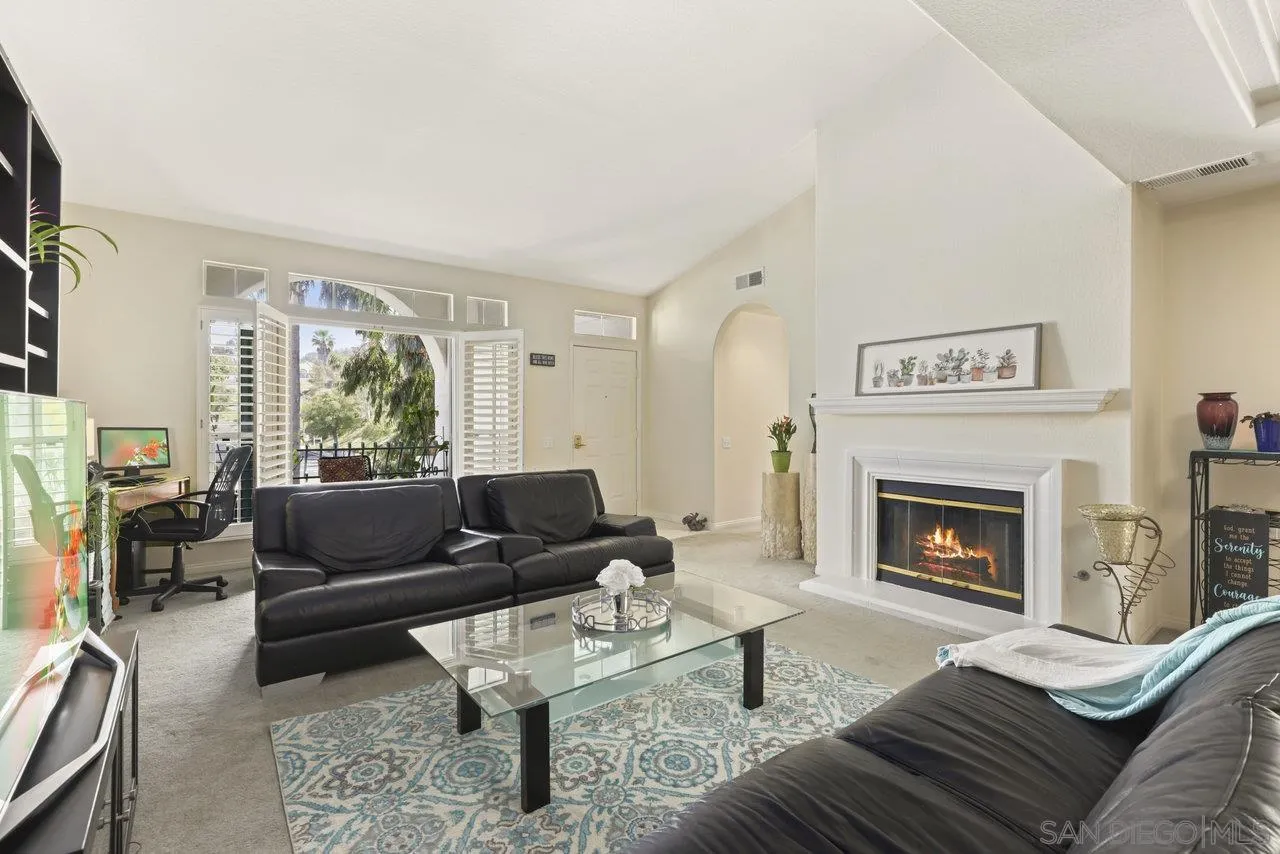3365 Genoa Way, Unit 140 Oceanside, CA 92056 - Photo 5 of 32 a living room with furniture and a fireplace