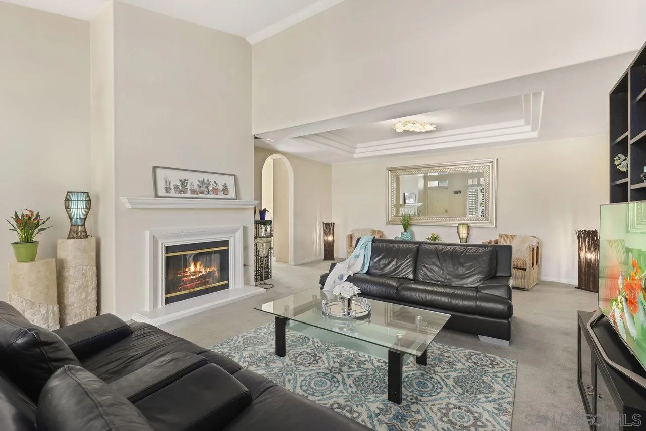 3365 Genoa Way, Unit 140 Oceanside, CA 92056 - Photo 6 of 32 a living room with furniture and a fireplace