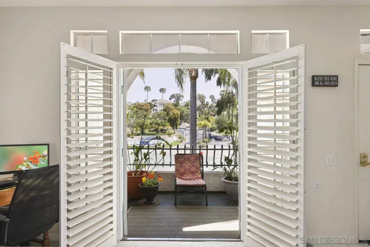 3365 Genoa Way, Unit 140 Oceanside, CA 92056 - Photo 9 of 32 a living room with furniture and a flat screen tv