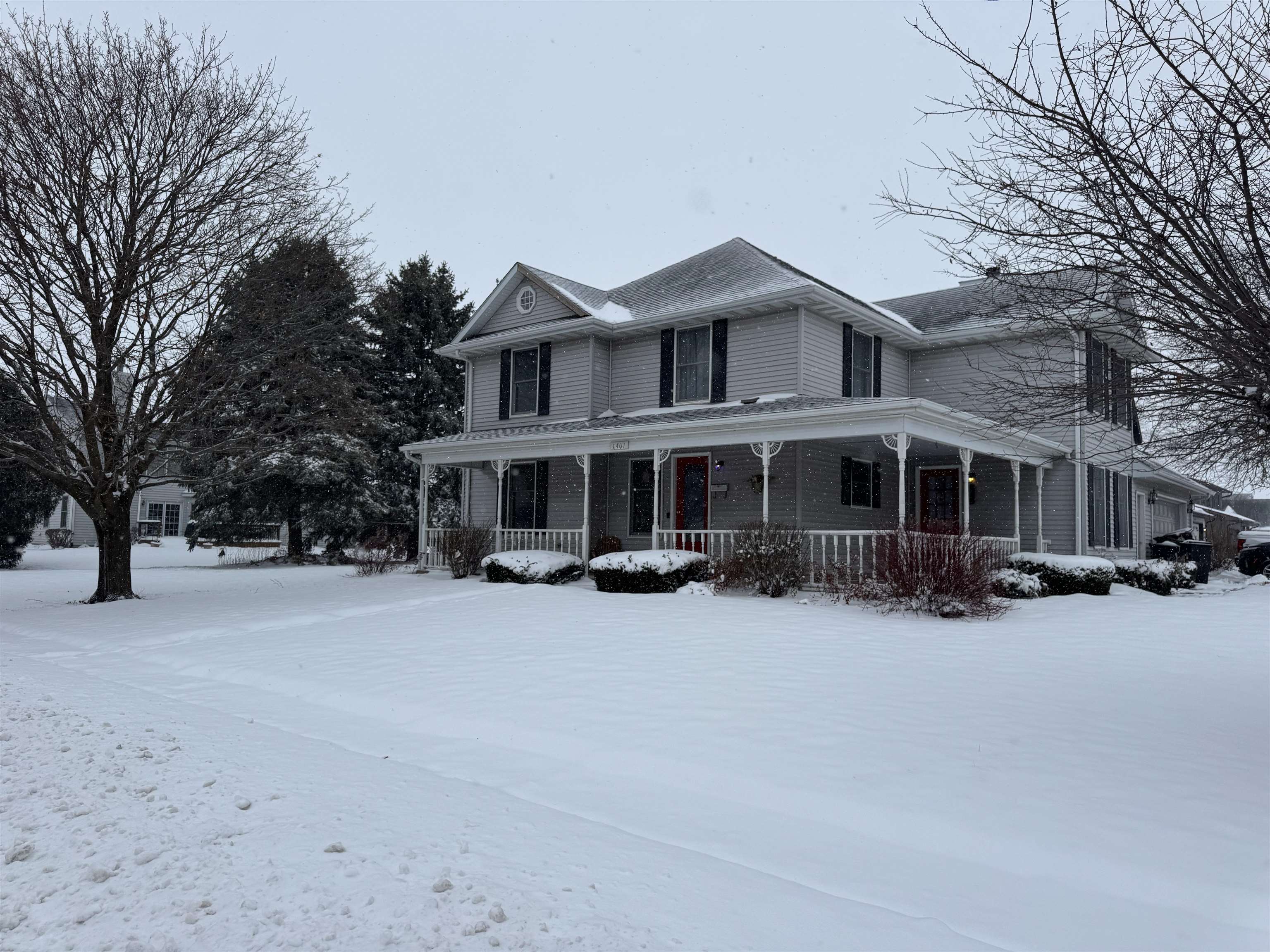 1401 Carrie Avenue Rochelle, IL 61068 - Photo 2 of 13 a view of a house with a yard covered in snow