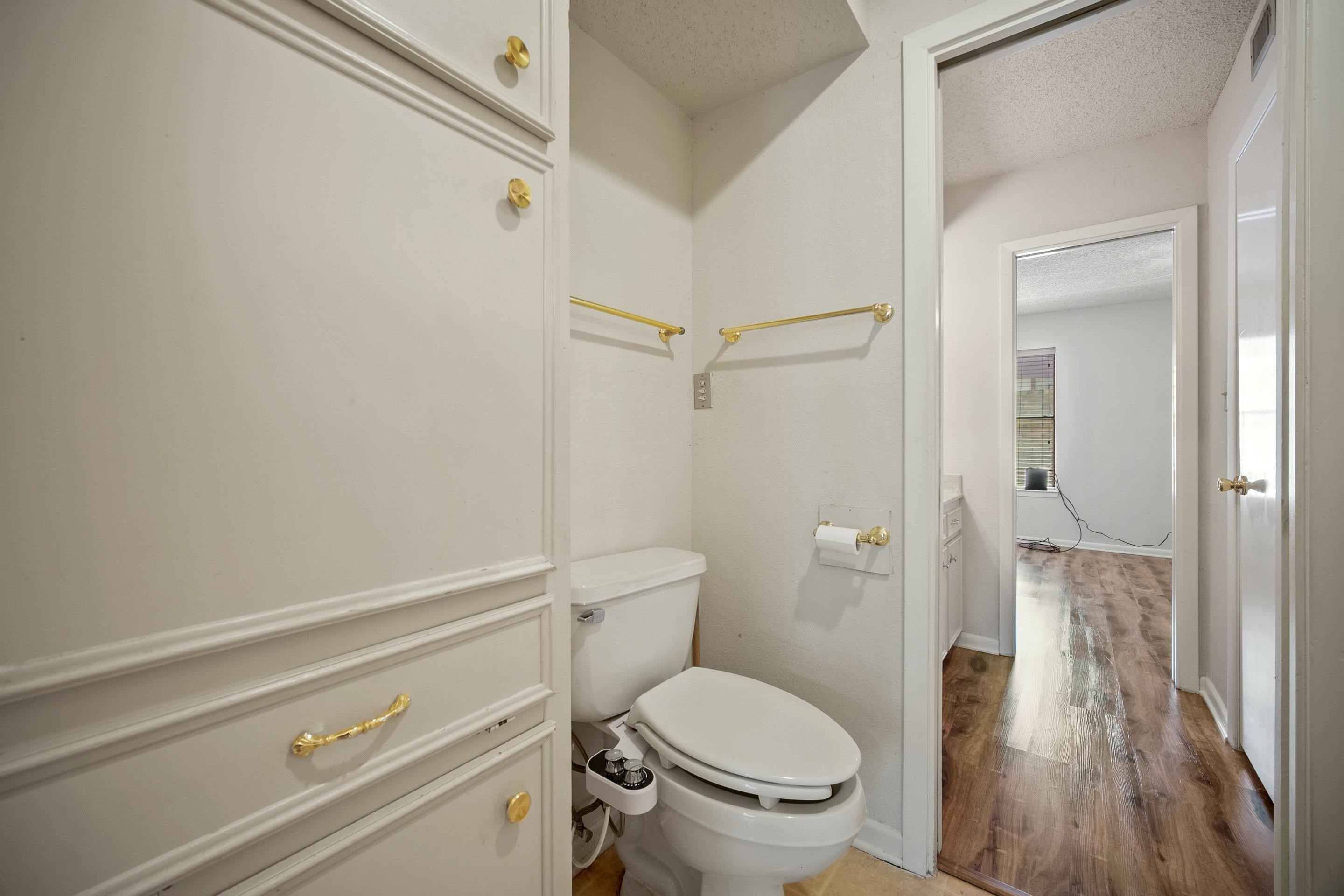1201 Ranch Road 1431, Unit 2 Marble Falls, TX 78654 - Photo 18 of 26 a bathroom with a toilet and a shower