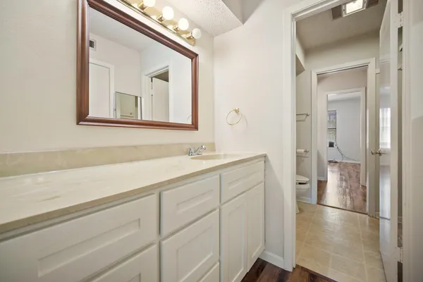 a bathroom with a sink a mirror and a shower