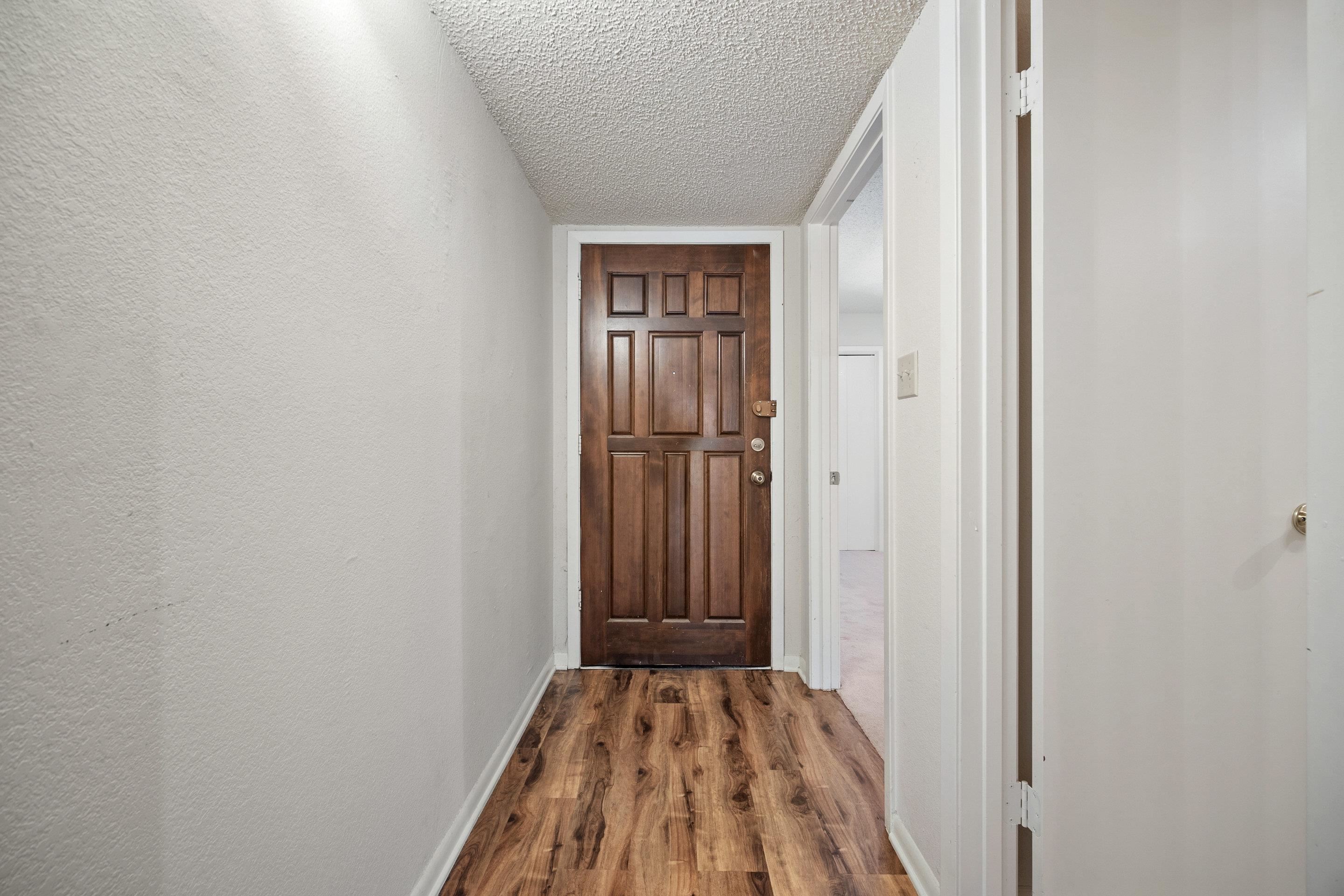 1201 Ranch Road 1431, Unit 2 Marble Falls, TX 78654 - Photo 2 of 26 a view of a room with wooden floor and closet