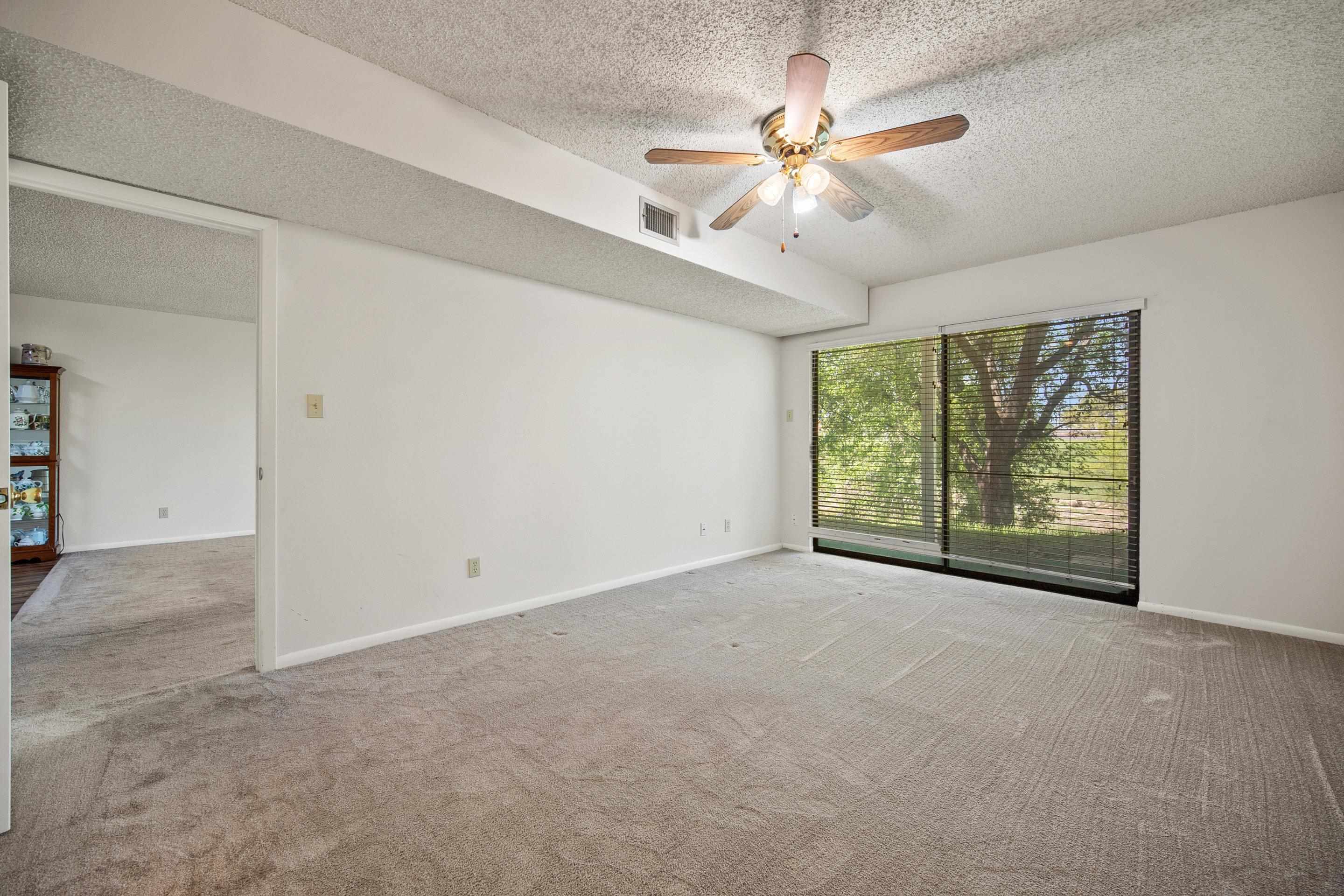1201 Ranch Road 1431, Unit 2 Marble Falls, TX 78654 - Photo 22 of 26 an empty room with windows and fan