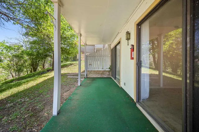 a view of a porch with garden