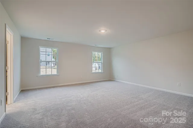 a bathroom with a double vanity sink mirror and shower