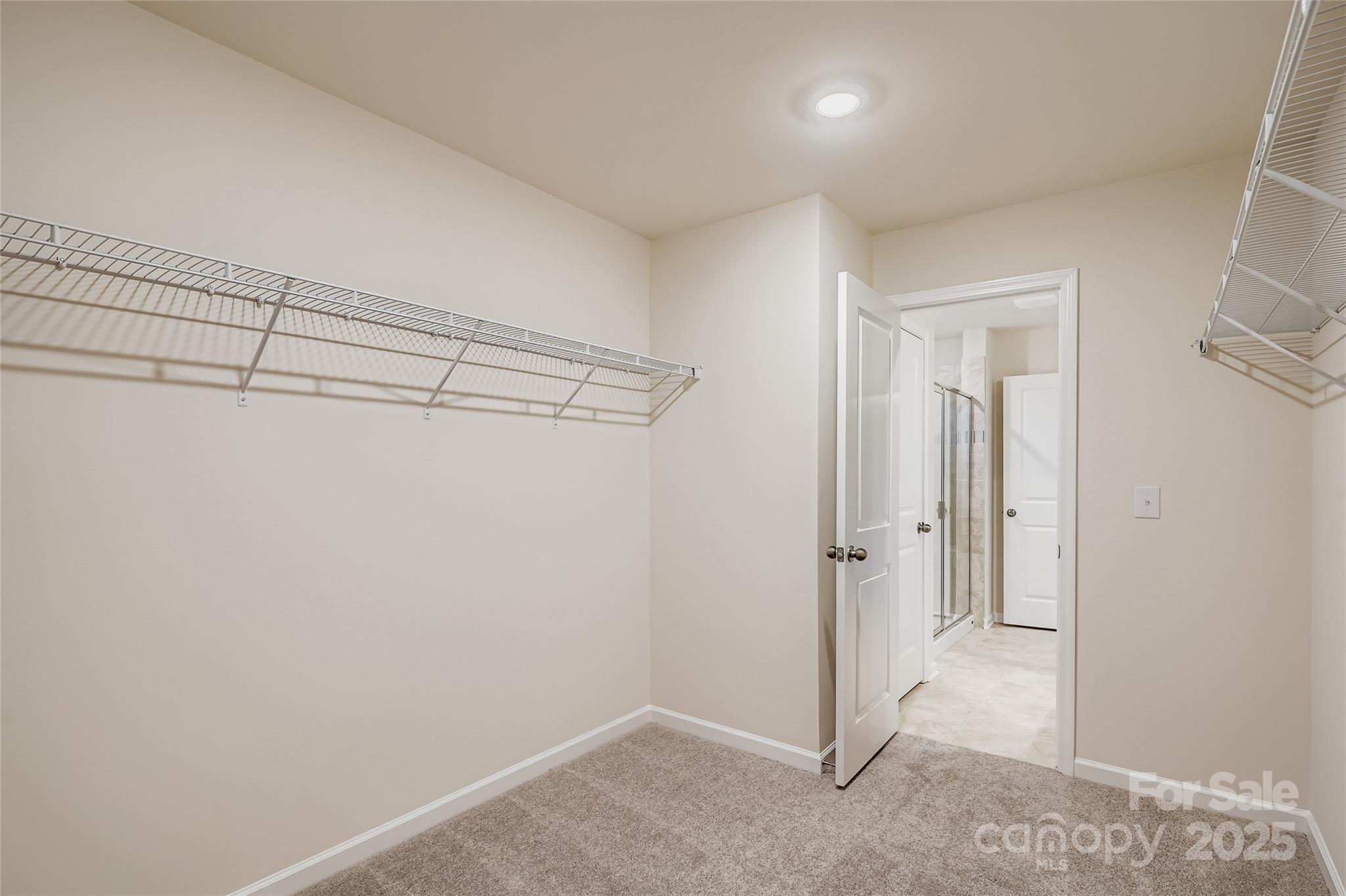 4356 Shimmering Stone Way Maiden, NC 28650 - Photo 8 of 13 a view of a room with racks on the wall