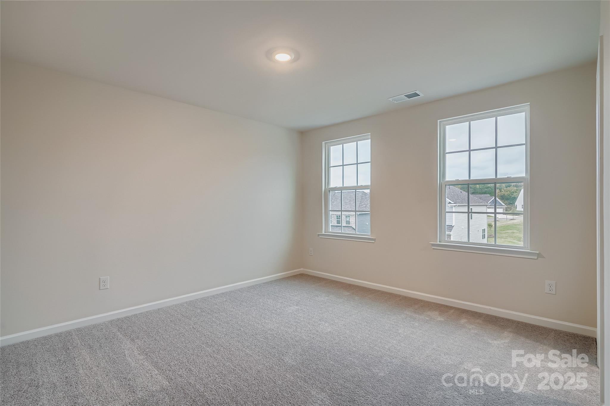 4356 Shimmering Stone Way Maiden, NC 28650 - Photo 9 of 13 an empty room with windows