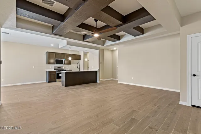 a view of a kitchen with a stove and a microwave